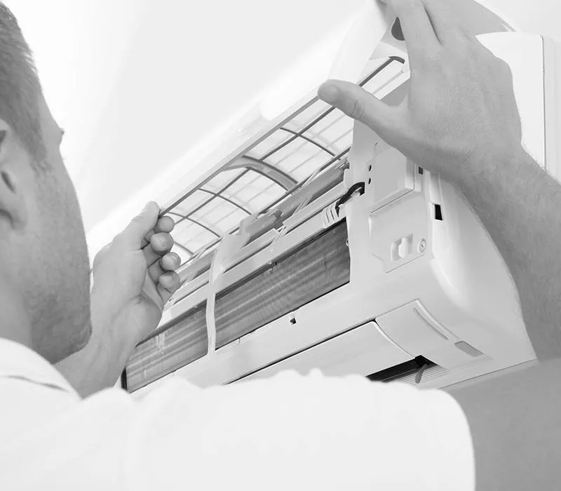 Underwood Heating and Air Conditioning licensed technician repairing an air conditioner in Phenix City Alabama