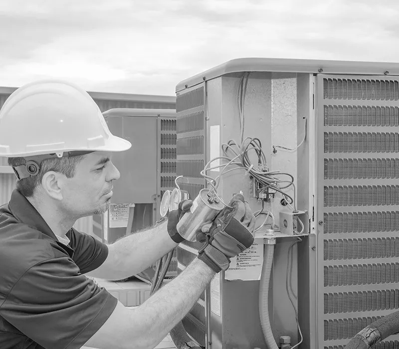 Underwood Heating and Air Conditioning technician repairing commercial HVAC equipment for a Phenix City Alabama facility